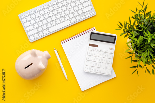 Financial accounting analisis with calculator on office table, top view