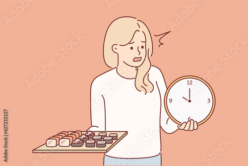 Woman with sushi rolls and hours nervous about long delivery time from japanese restaurant