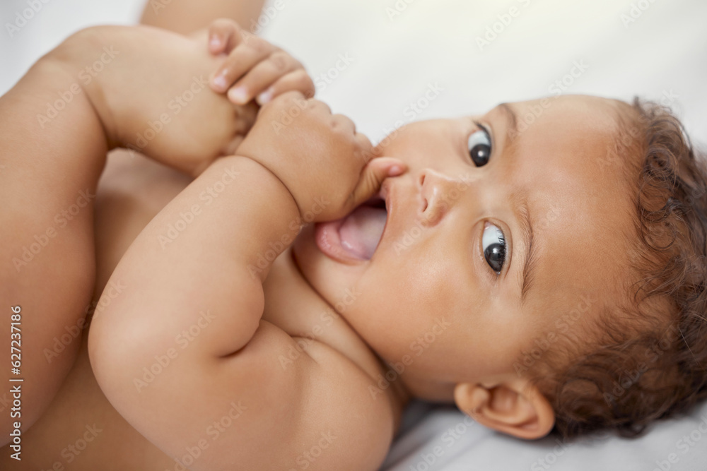 Baby, portrait and child play with feet on bed in home having fun and enjoying time alone. Face, newborn and playing with foot, toes and cute infant, kid or toddler with growth, development and relax Baby, portrait and child play with feet on bed in home having fun and enjoying time alone. Face, newborn and playing with foot, toes and cute infant, kid or toddler with growth, development and relax
