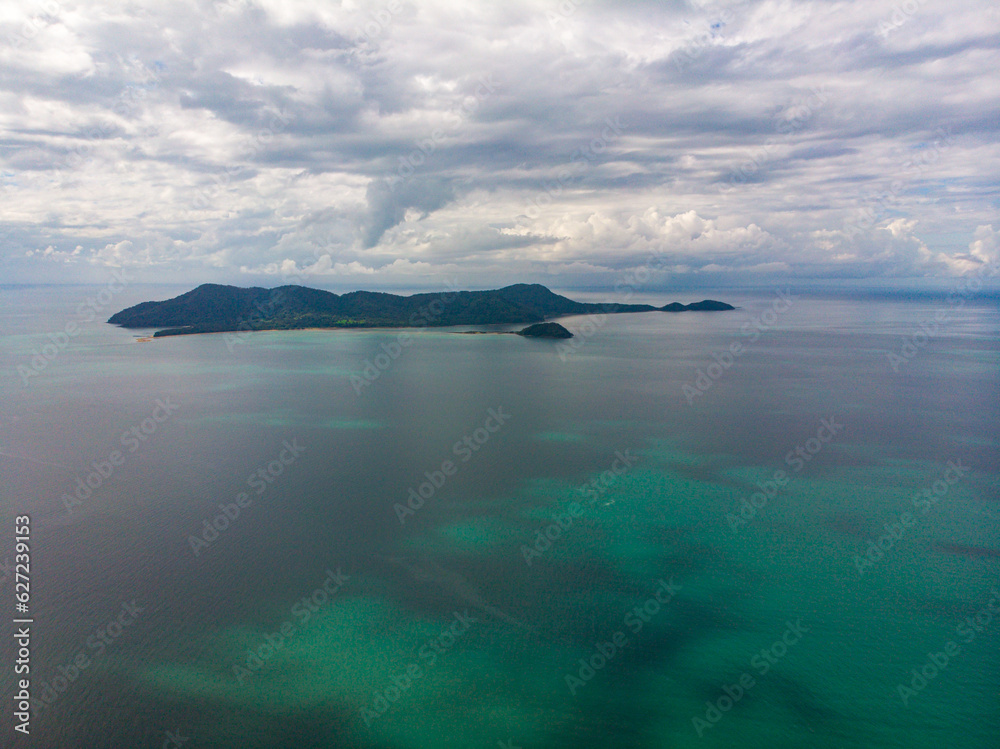 aerial drone panorama of family islands as seen from south mission beach, north queensland, australia; paradise little island surrounded by coral reefs on the shore of pacific