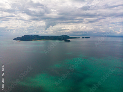 aerial drone panorama of family islands as seen from south mission beach, north queensland, australia; paradise little island surrounded by coral reefs on the shore of pacific