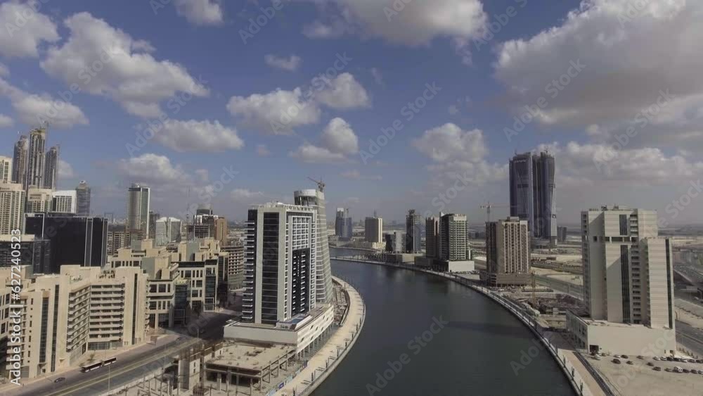 DUBAI, UAE - DECEMBER 2016: Aerial view of Downtown Dubai at sunset. The city attracts 20 million people annually DUBAI, UAE - DECEMBER 2016: Aerial view of Downtown Dubai at sunset. The city attracts 20 million people annually