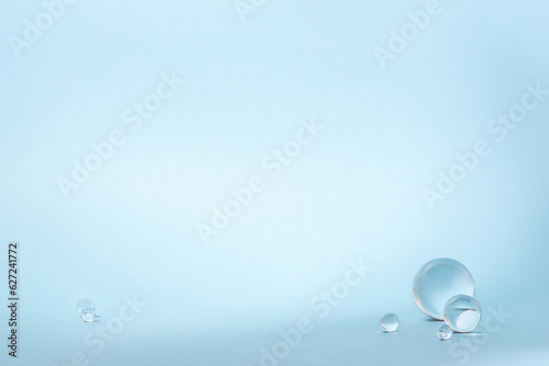 Blue background with transparent glass balls.