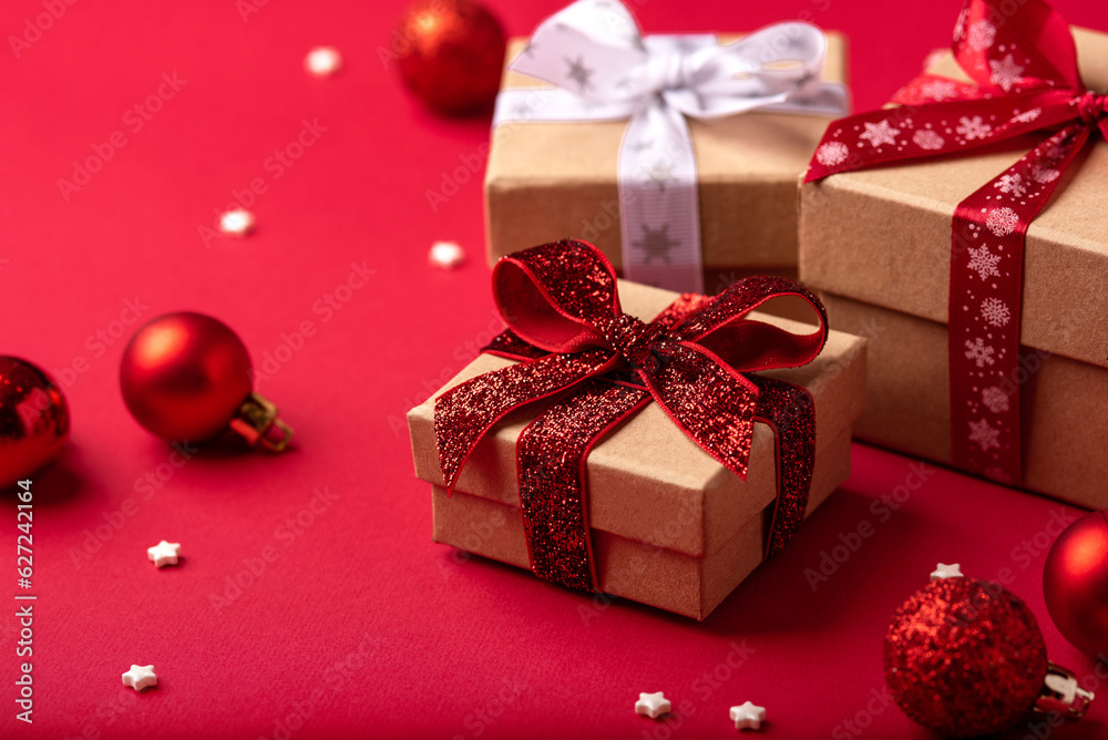 Christmas gift boxes with red balls on red background. Christmas gift boxes with red balls on red background.