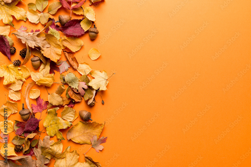 Autumn composition. Pattern made of dried leaves and other design accessories on table. Flat lay, top view - obrazy, fototapety, plakaty 