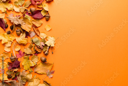 Autumn composition. Pattern made of dried leaves and other design accessories on table. Flat lay, top view photo