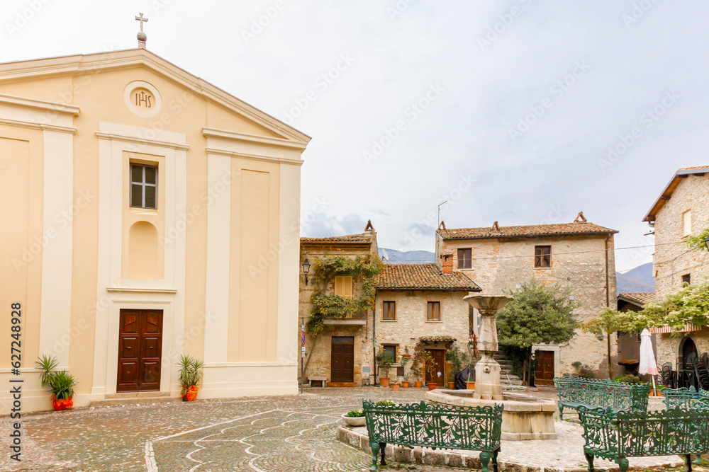 Colle di Tora, the square with the church and the fountain. Italy.