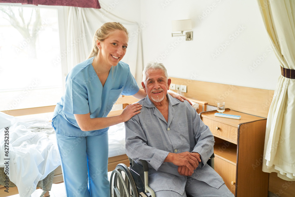 Smiling nurse with elderly man in wheelchair at rehab center Smiling nurse with elderly man in wheelchair at rehab center