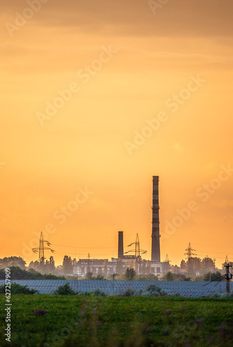 oil refinery at sunset