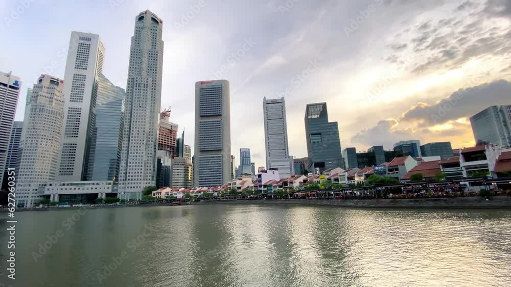 SINGAPORE - JANUARY 3, 2019: Singapore river and skyline at sunset from a moving boat