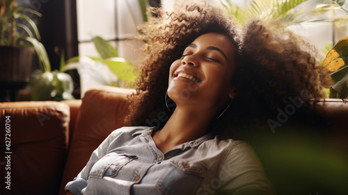 Happy Afro American woman relaxing on the sofa at home,Healthy life style, good vibes people and new home concept