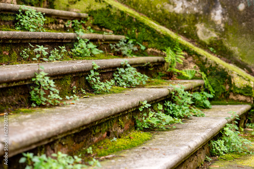 Photos Steps of old weathered outdoor stairs made of concrete in old town of Luino Italy in summer