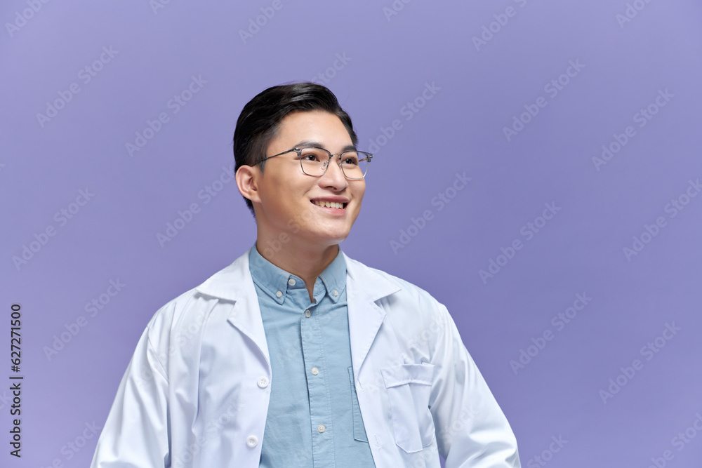 Doctor posing with arms crossed, medical staff working on purple background. Doctor posing with arms crossed, medical staff working on purple background.