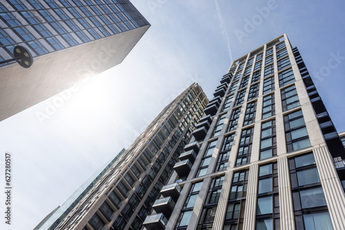 Modern buildings in London viewed from below with sunlight.