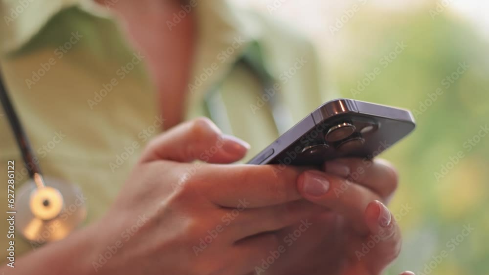 The doctor works with a smartphone. Online consultation. The doctor works with a smartphone. Online consultation.