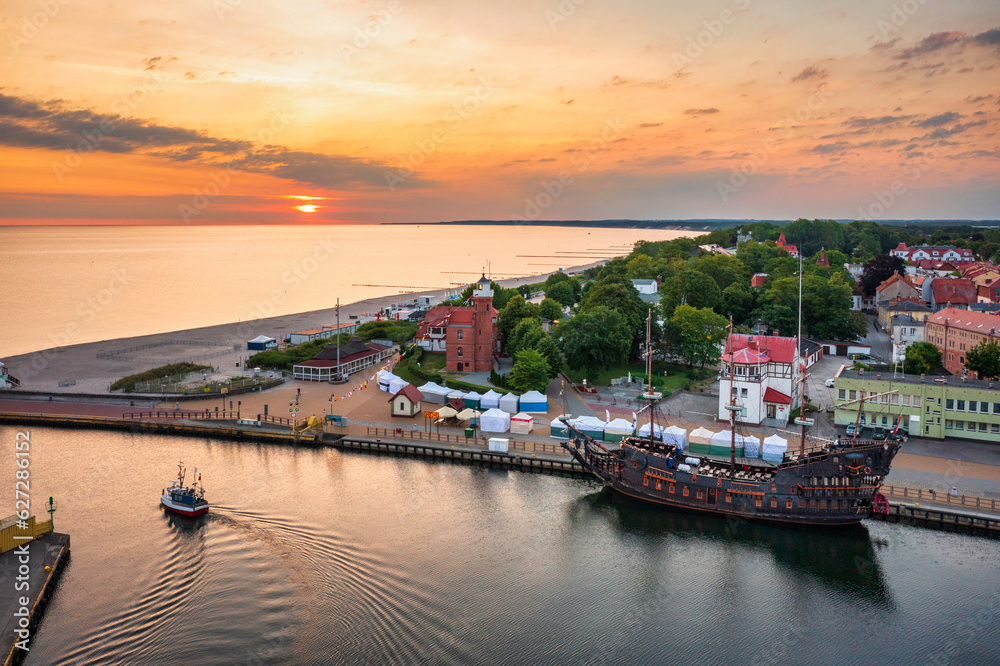 Lighthouse in Ustka by the Baltic Sea at sunrise, Poland.