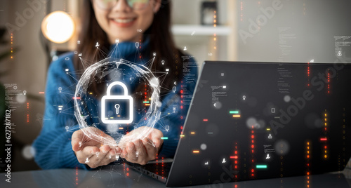 Cybersecurity technology concept. A person is using a computer with data privacy protection from digital threats. Protect system hardware, software and applications Connect to work on the Internet.