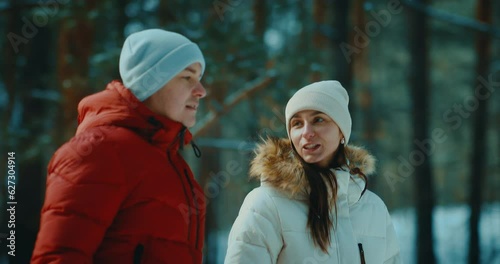 young people in love walking together in forest in winter day, romantic date in nature, 4K, Prores