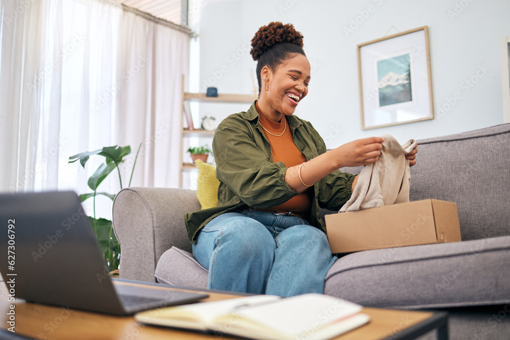 Online shopping, woman on sofa with package and smile, discount fashion retail and laptop in living room. Delivery of clothes, ecommerce and happy person on couch with box from website sale or deal.