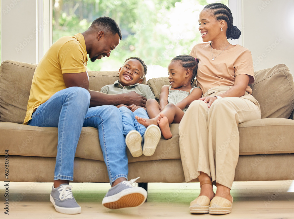 Tickling, laughing and black family with children on home sofa for happiness, love and care. African kids, man and a woman or parents together on couch for fun, quality time and bonding while playing Tickling, laughing and black family with children on home sofa for happiness, love and care. African kids, man and a woman or parents together on couch for fun, quality time and bonding while playing