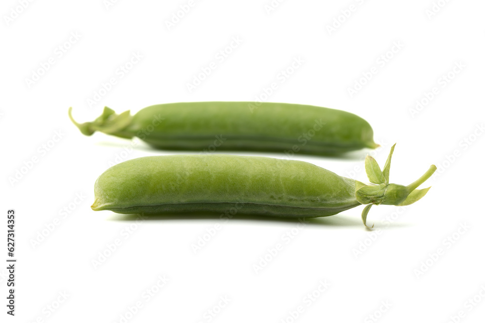 Soft focus on ripe closed pea pods on white background. Focus on the front pod. Soft focus on ripe closed pea pods on white background. Focus on the front pod.