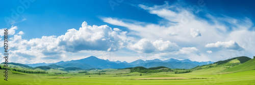 Panoramic natural landscape with a green grass field  blue sky with clouds  and mountains in the background. Panorama summer spring meadow. Generative AI.