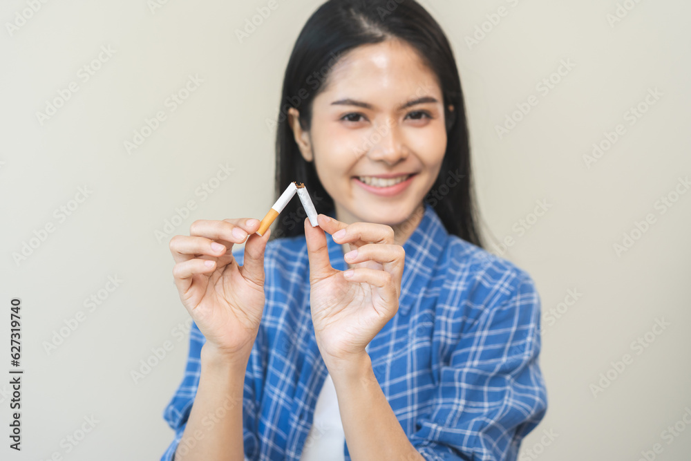Quit, stop smoking, addiction asian young woman, girl refusing cigarette, smoker quitting smoke, hand in broken, break tobacco. Quit bad habit, health care concept. Willpower lifestyle of people. Quit, stop smoking, addiction asian young woman, girl refusing cigarette, smoker quitting smoke, hand in broken, break tobacco. Quit bad habit, health care concept. Willpower lifestyle of people.