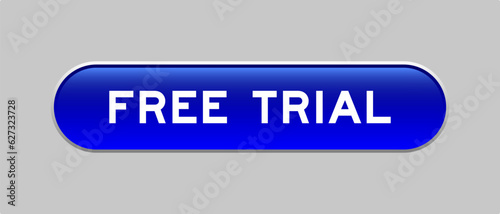 Blue color capsule shape button with word free trial on gray background