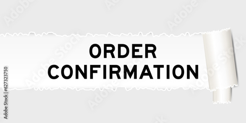 Ripped gray paper background that have word order confirmation under torn part