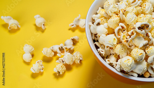 Popcorn in a bowl on a yellow background