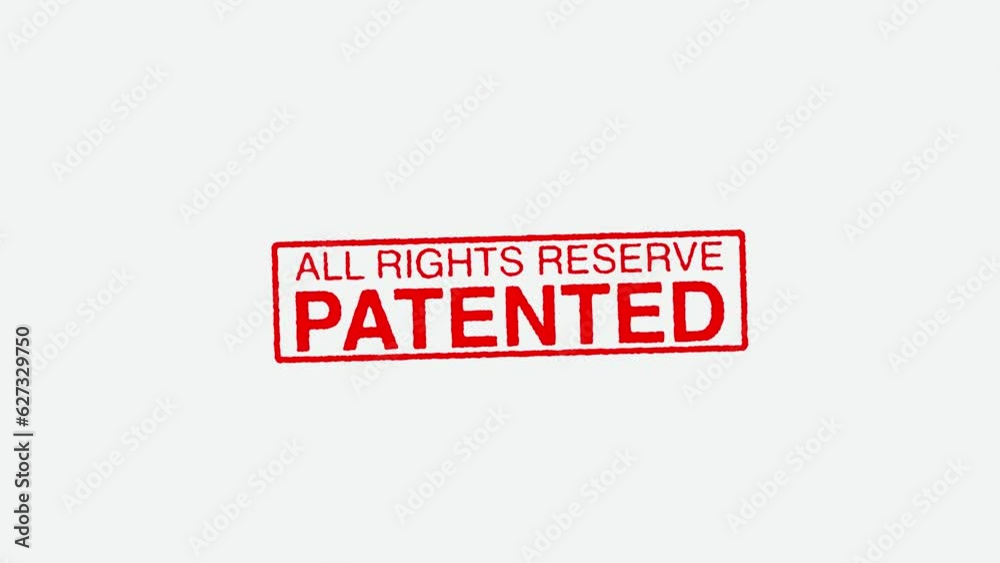 Close Up Real Hand Stamping All Rights Reserve Patented Stamp on White Background Close Up Real Hand Stamping All Rights Reserve Patented Stamp on White Background