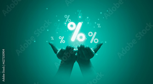Tableau sur toile Two hand holding  percentage symbol for financial banking increase interest rate or mortgage investment dividend from business growth concept