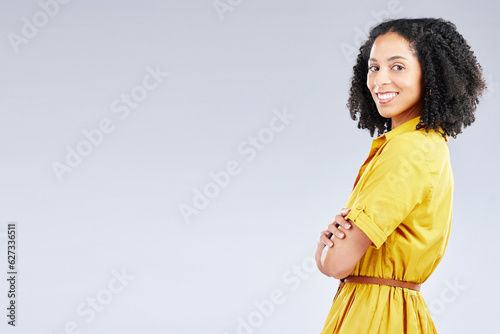 Portrait, fashion and mockup with a woman arms crossed in studio on a white background for trendy style. Yellow, smile and banner with a happy young person with an afro in a clothes outfit on space