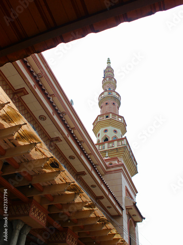 View of minaret and ceiling of a mosque. 
