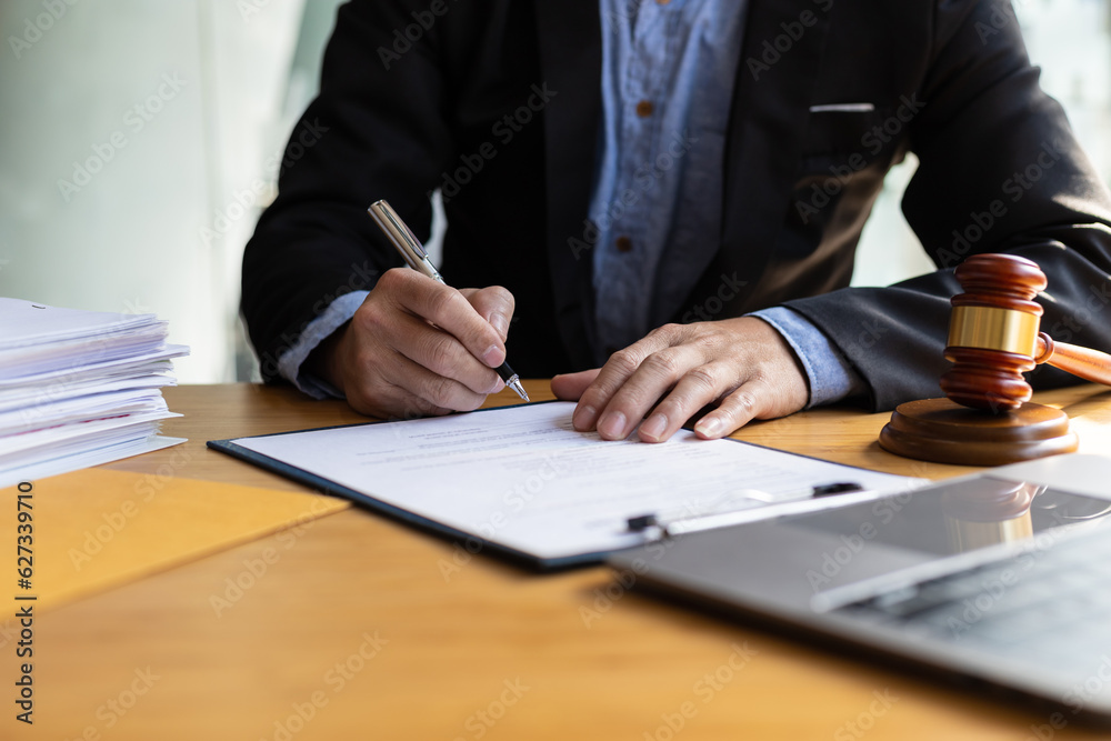 Close up of lawyer or businessman signing a document. Close up of lawyer or businessman signing a document.