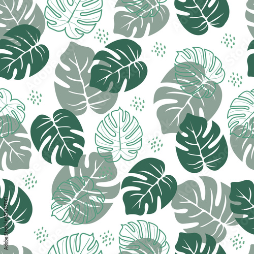 Floral seamless pattern of monstera leaves. Exquisite allover printed greenery whimsical arrangement of tropical foliage motifs