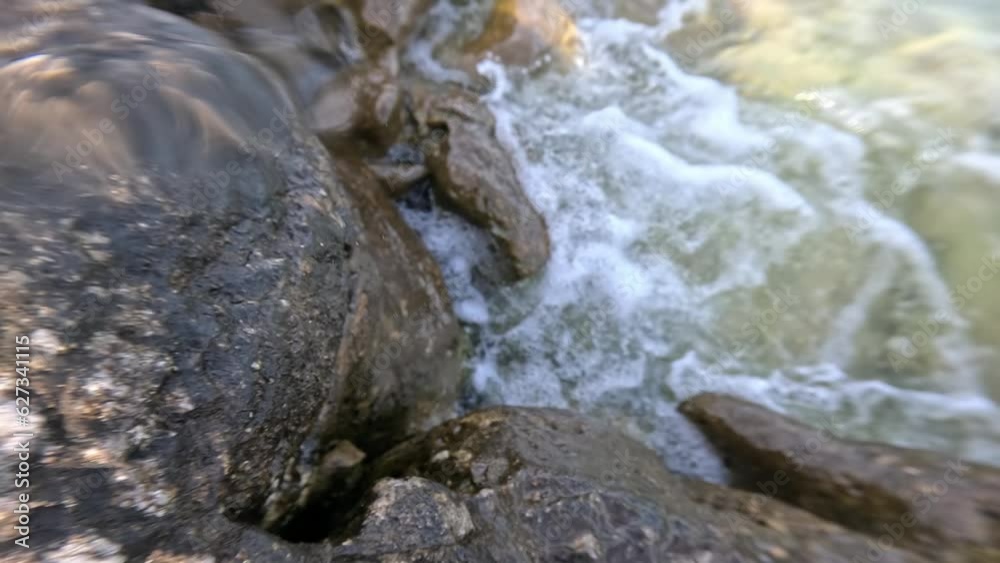 Splashing water on the rocks in slow motion Splashing water on the rocks in slow motion