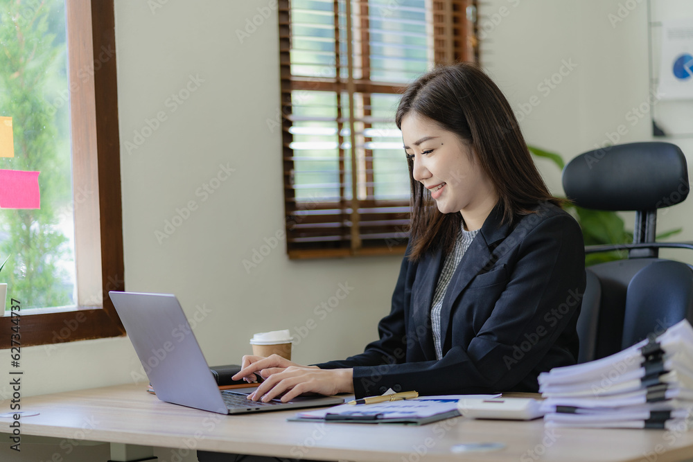 Business woman using tablet and laptop to do financial math, tax, reporting, accounting, statistics and analytical research concept. Make documents at work using your computer's online software.