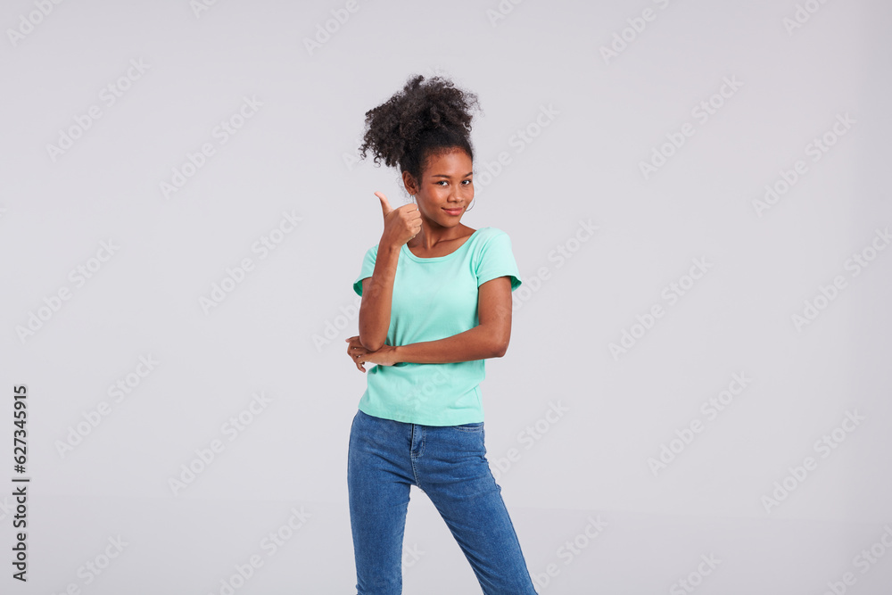 With refreshing style, a Thai American woman showcases her fashion sense in a mint shirt and blue jeans for her studio capture. With refreshing style, a Thai American woman showcases her fashion sense in a mint shirt and blue jeans for her studio capture.