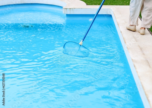 Cleaning the pool on summer holidays