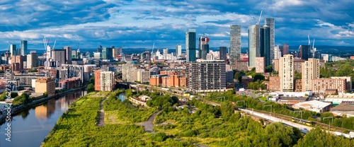 Fotografering Manchester Skyline Panorama with a Cloudy Sky