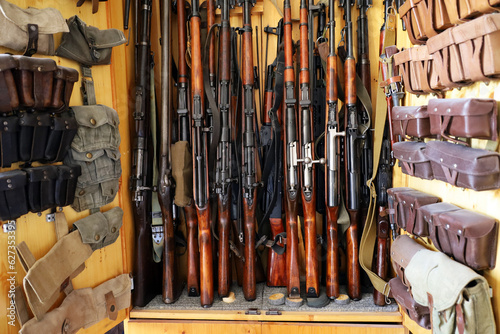 Fototapeta Automatic weapon collection, rifles and machine guns with ammunition