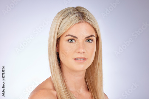 Portrait, blonde woman and beauty of hair care, natural skincare and aesthetic wellness on studio background. Face, female model and focus on dermatology of cosmetics, salon shampoo and healthy shine