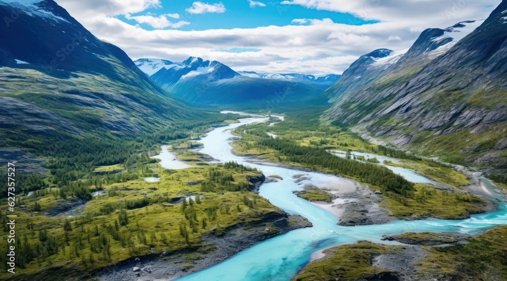Scenic aerial view of the mountain landscape with a forest and the crystal blue river in Jotunheimen National Park stock photo 