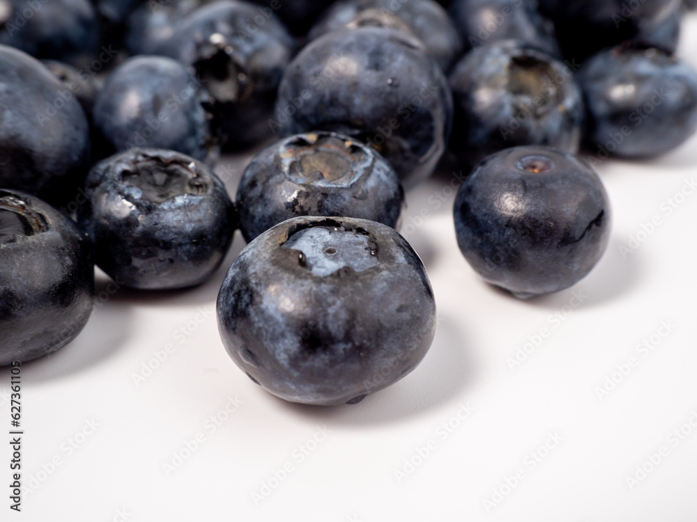 Ripe blueberries on a light background. blueberries close up Ripe blueberries on a light background. blueberries close up