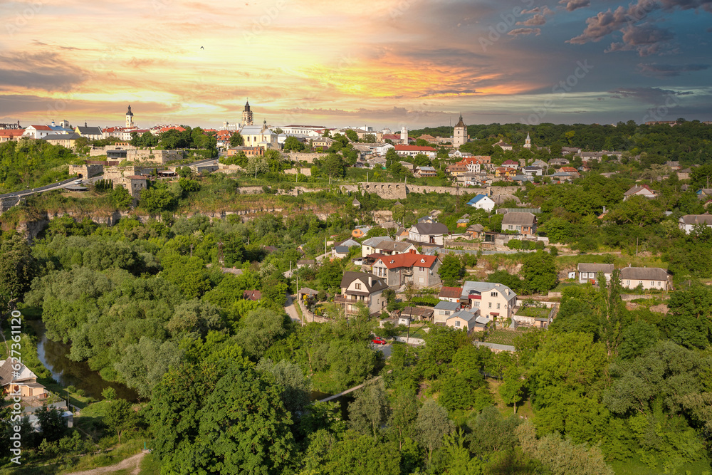 Fototapeta premium Kamianets-Podilskyi cityscape with dramatic sunset, Ukraine.