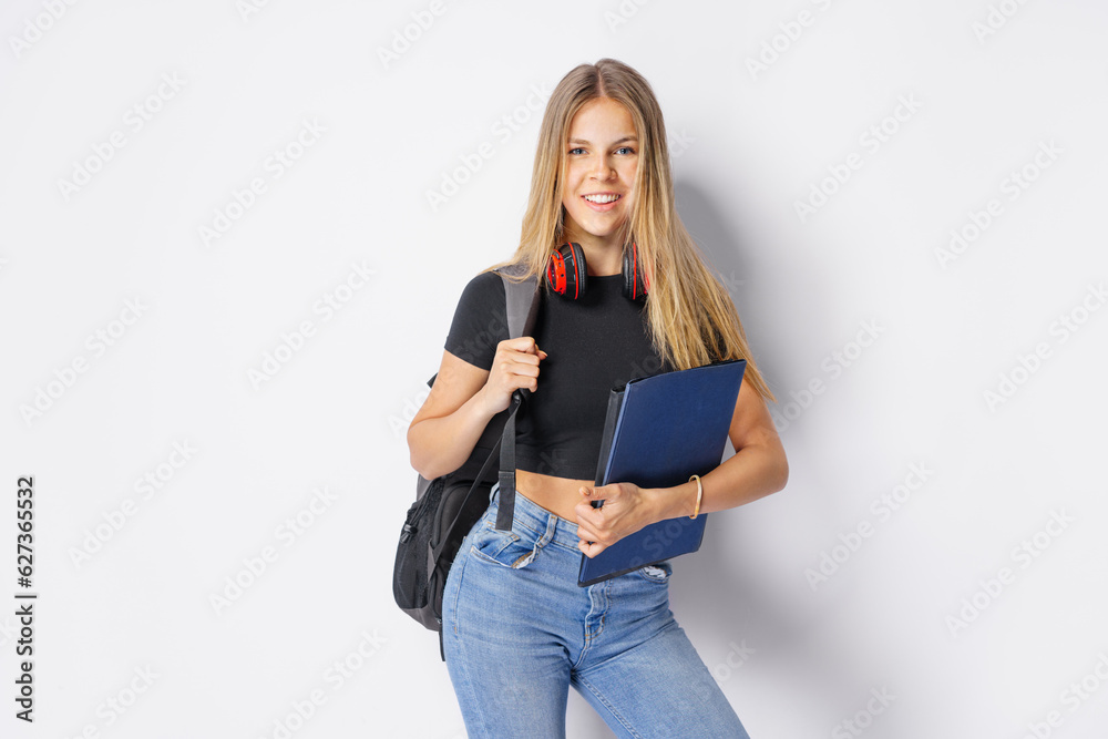 Studio shot of glad female student on isolated white Bachground. Studio shot of glad female student on isolated white Bachground.