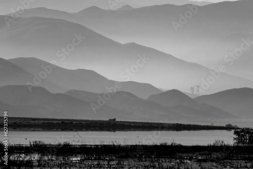 misty morning in the mountains in black and white showing various shades of gray at sunrise