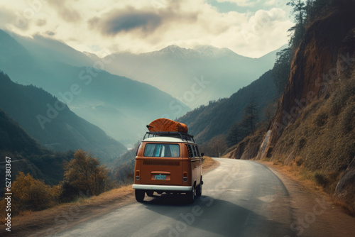 Classic camper van traveling through a mountainous landscape. Car trip on summer vacation