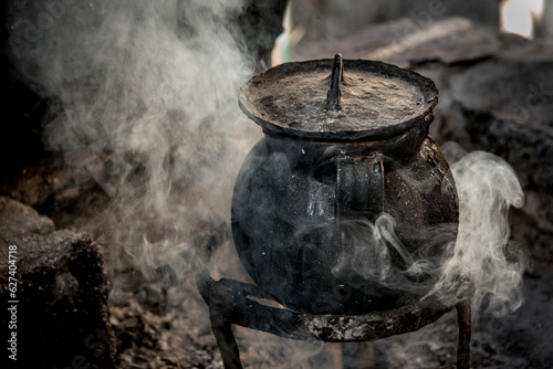 Cast iron cooking pot simmers; Ejido Hidalgo, San Luis, Mexico photo